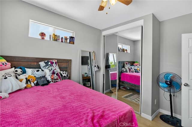8627 John Ave, Los Angeles, CA 90002 - bedroom with wood finished floors, a closet, and ceiling fan