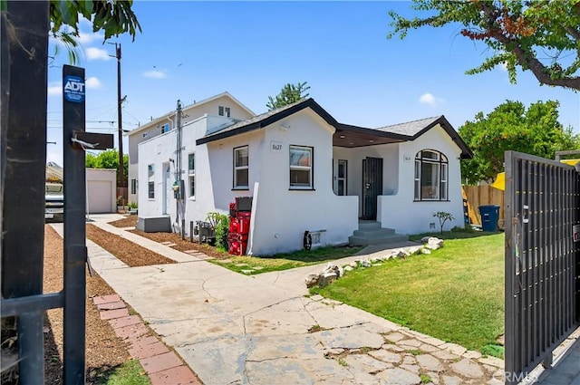 8627 John Ave, Los Angeles, CA 90002 - view of front of property with stucco siding and a gate