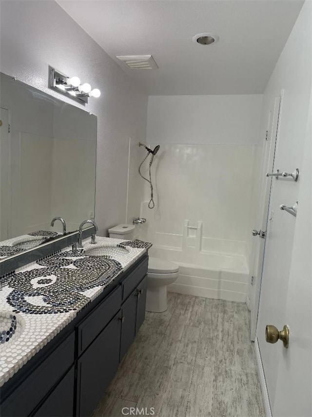 14730 S Normandie Ave Unit 3, Gardena, CA 90247 - bathroom with wood finished floors, vanity, and shower / washtub combination