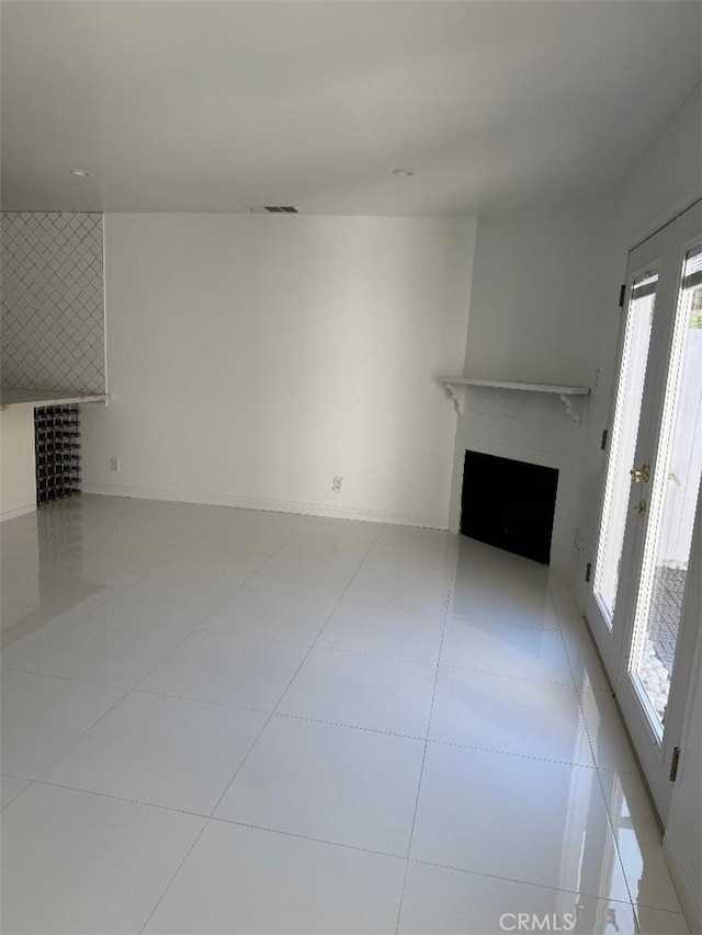 14730 S Normandie Ave Unit 3, Gardena, CA 90247 - unfurnished living room with a fireplace and light tile patterned floors