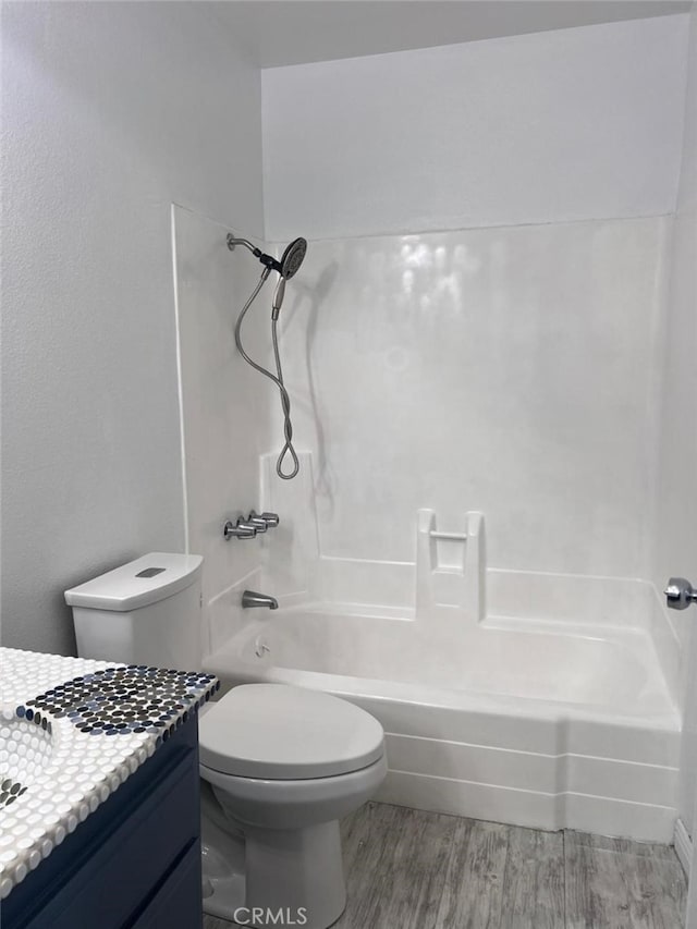 14730 S Normandie Ave Unit 3, Gardena, CA 90247 - full bathroom with vanity, bathing tub / shower combination, and wood finished floors