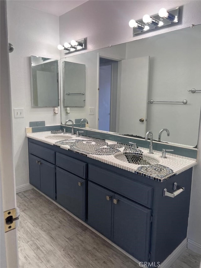 14730 S Normandie Ave Unit 3, Gardena, CA 90247 - bathroom featuring double vanity and wood finished floors