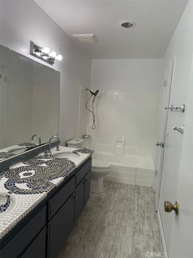 14730 S Normandie Ave Unit 3, Gardena, CA 90247 - bathroom with wood finished floors, vanity, and bathtub / shower combination