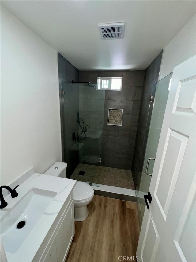 1737 W 65th Pl, Los Angeles, CA 90047 - bathroom with wood finished floors, a stall shower, and vanity
