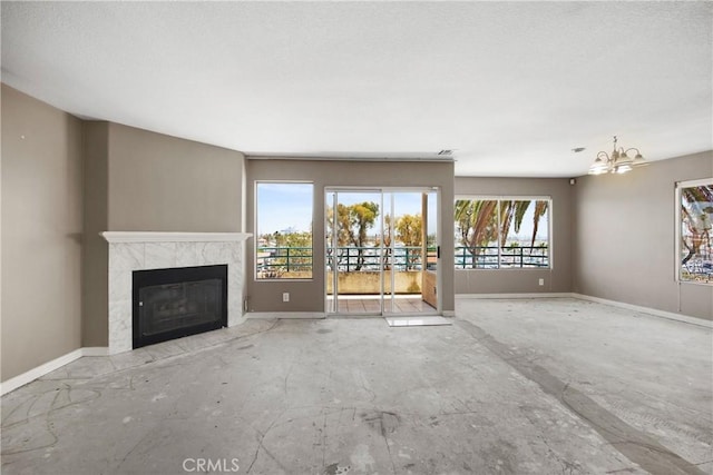 2222 S Mesa St Unit 8, San Pedro, CA 90731 - unfurnished living room featuring a chandelier and a fireplace