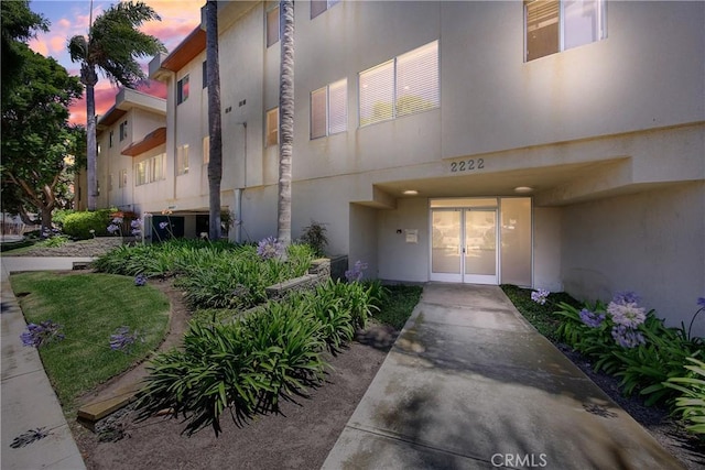 2222 S Mesa St Unit 8, San Pedro, CA 90731 - exterior entry at dusk with french doors and stucco siding