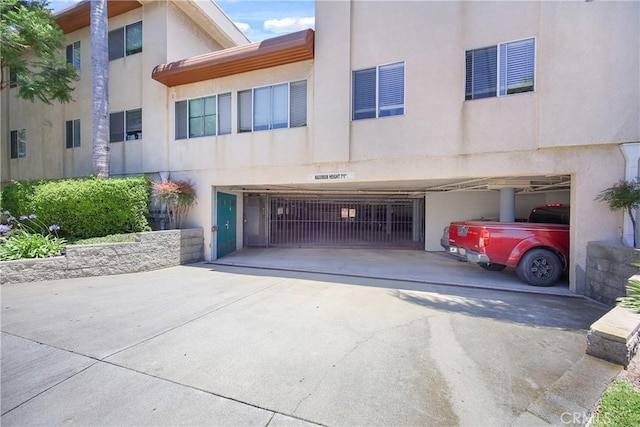 2222 S Mesa St Unit 8, San Pedro, CA 90731 - view of front of home featuring stucco siding, concrete driveway, and an attached garage