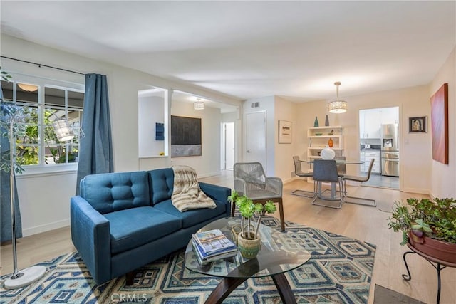 14453 Watkins Dr, La Mirada, CA 90638 - living area featuring light wood-style flooring and baseboards