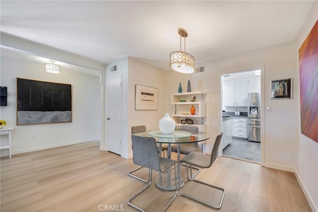 14453 Watkins Dr, La Mirada, CA 90638 - dining space with light wood-style floors and baseboards