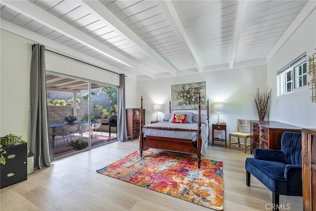 14453 Watkins Dr, La Mirada, CA 90638 - bedroom featuring access to outside, multiple windows, wood finished floors, and beamed ceiling