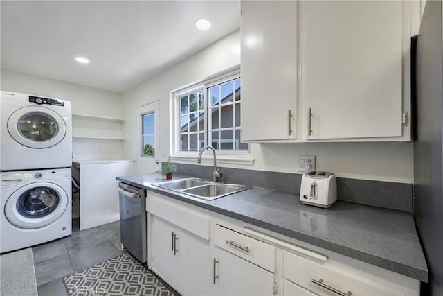 14453 Watkins Dr, La Mirada, CA 90638 - laundry room featuring stacked washer / dryer, dark tile patterned floors, and recessed lighting