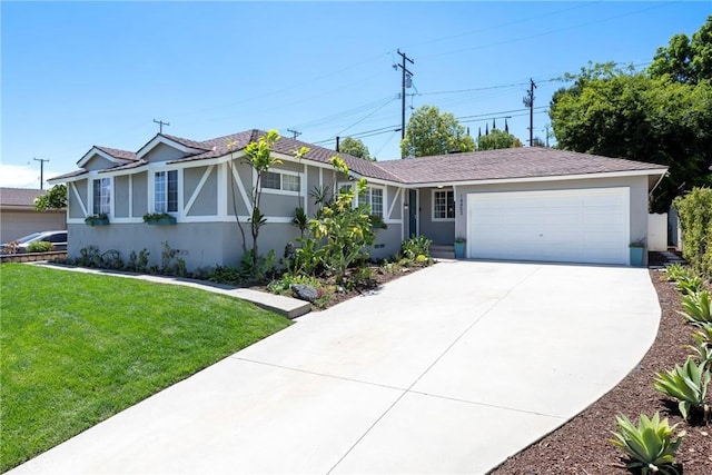 14453 Watkins Dr, La Mirada, CA 90638 - ranch-style home featuring an attached garage, concrete driveway, a front lawn, and stucco siding