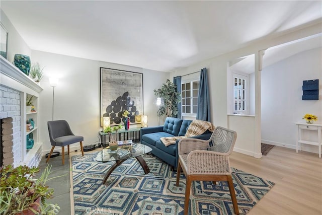14453 Watkins Dr, La Mirada, CA 90638 - living room with a brick fireplace and wood finished floors