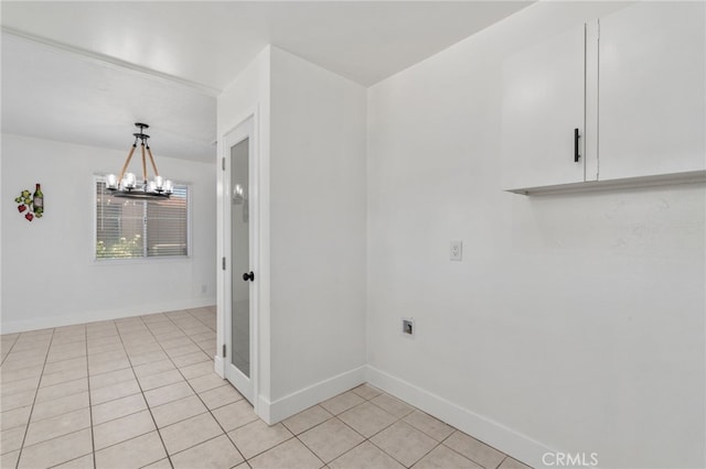5619 Daisy Ave Unit 29, Palms, CA 92277 - empty room featuring light tile patterned floors and a chandelier