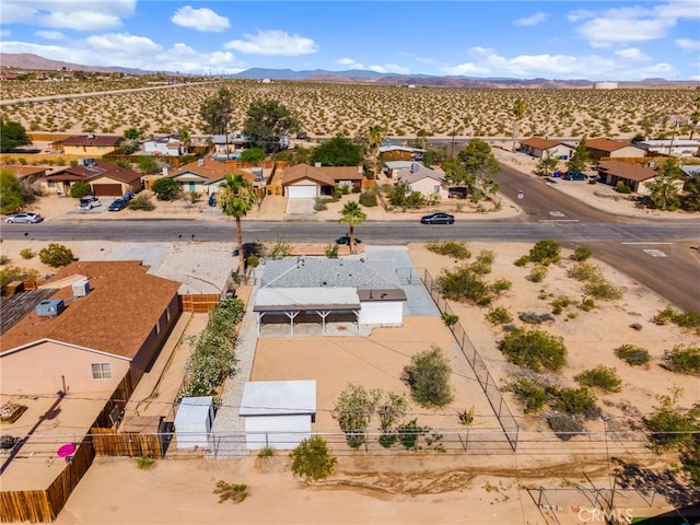 5619 Daisy Ave Unit 29, Palms, CA 92277 - aerial perspective of suburban area featuring a mountain backdrop and a desert landscape