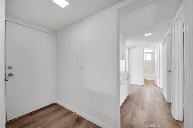 1755 Matthew Ln, Hemet, CA 92545 - hallway with light wood-type flooring and baseboards