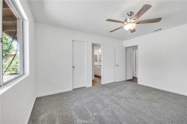 1755 Matthew Ln, Hemet, CA 92545 - unfurnished bedroom featuring carpet, connected bathroom, and a ceiling fan