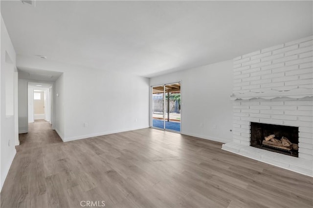 1755 Matthew Ln, Hemet, CA 92545 - unfurnished living room with wood finished floors and a fireplace