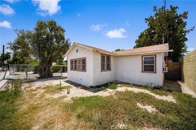 9804 Palmetto Ave, Fontana, CA 92335 - view of property exterior featuring stucco siding and a fenced backyard