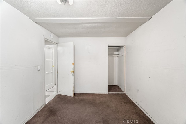 9804 Palmetto Ave, Fontana, CA 92335 - unfurnished bedroom with carpet floors, a textured ceiling, and a closet