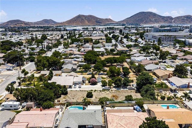 9804 Palmetto Ave, Fontana, CA 92335 - aerial perspective of suburban area with a mountainous background