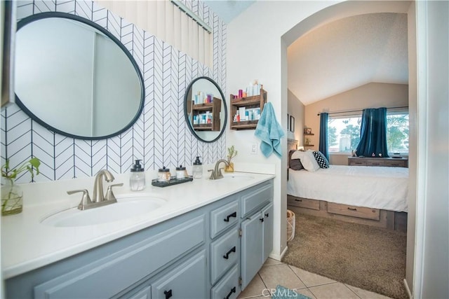 11025 Kenyon Way, Rancho Cucamonga, CA 91701 - ensuite bathroom featuring double vanity, lofted ceiling, and tile patterned floors