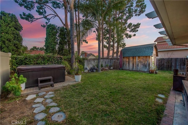 11025 Kenyon Way, Rancho Cucamonga, CA 91701 - yard at dusk featuring a hot tub, a storage shed, and a fenced backyard