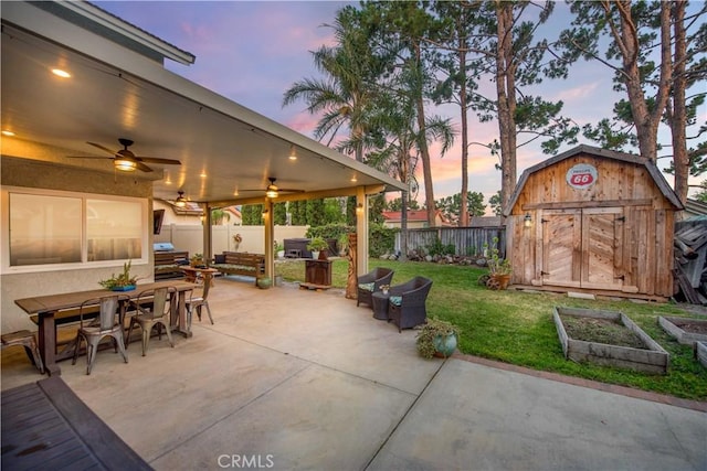 11025 Kenyon Way, Rancho Cucamonga, CA 91701 - patio terrace at dusk with a shed, a fenced backyard, a patio area, and outdoor dining space