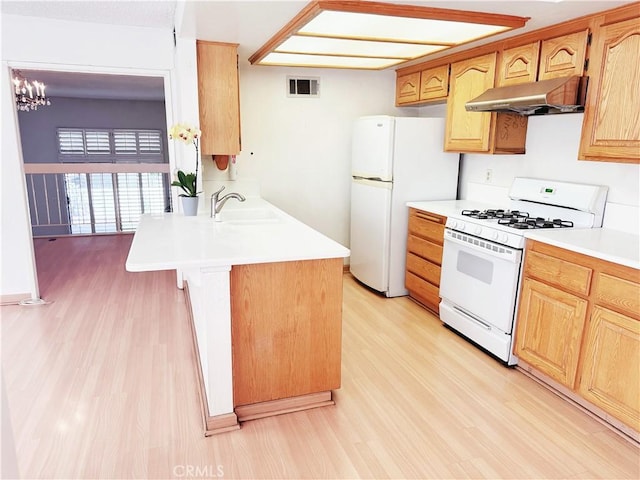 1525 Welldow Ln, Fullerton, CA 92831 - kitchen featuring white appliances, under cabinet range hood, light wood finished floors, and light countertops