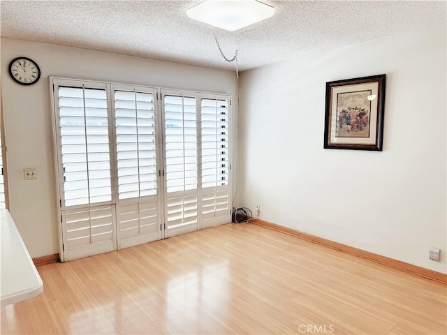 1525 Welldow Ln, Fullerton, CA 92831 - unfurnished room with wood finished floors and a textured ceiling