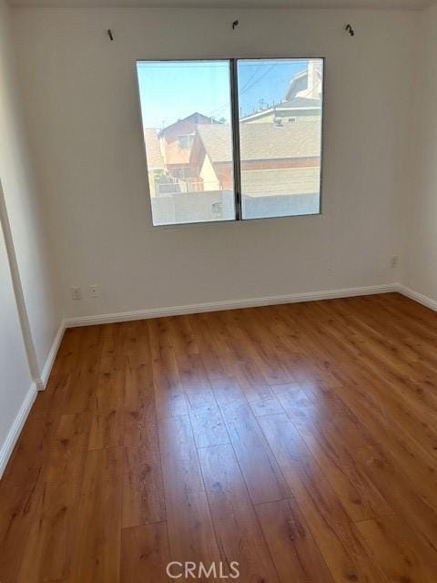 535 Magnolia Ave Unit 101, Long Beach, CA 90802 - empty room with hardwood / wood-style flooring