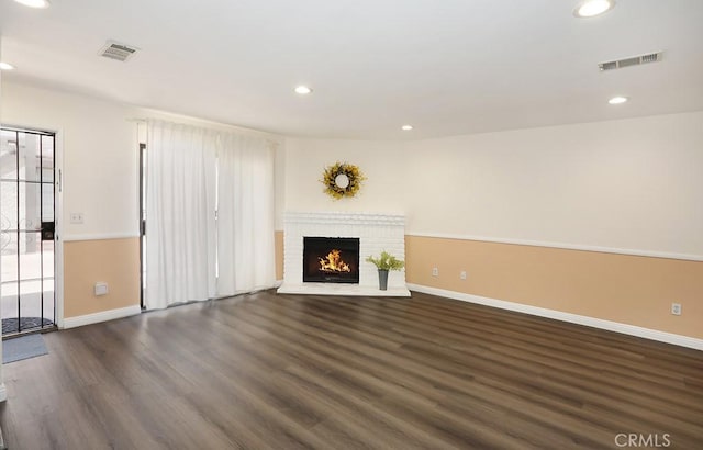 1419 W 179th St Unit 3, Gardena, CA 90248 - unfurnished living room with dark wood-style flooring, a brick fireplace, and recessed lighting