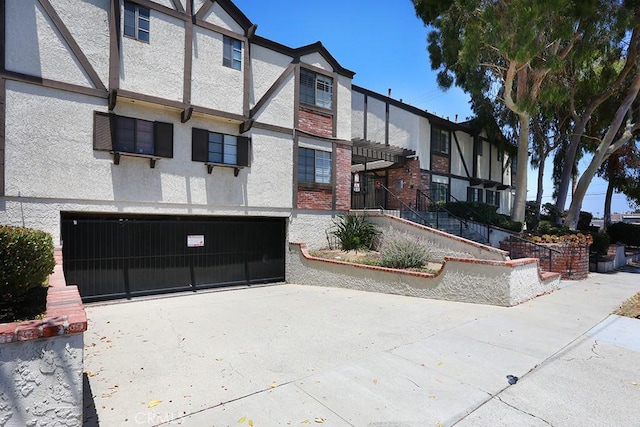 1419 W 179th St Unit 3, Gardena, CA 90248 - view of building exterior with a garage and concrete driveway