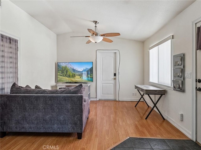 14719 Juniper St, Hesperia, CA 92345 - living area featuring lofted ceiling, ceiling fan, and light wood-style floors