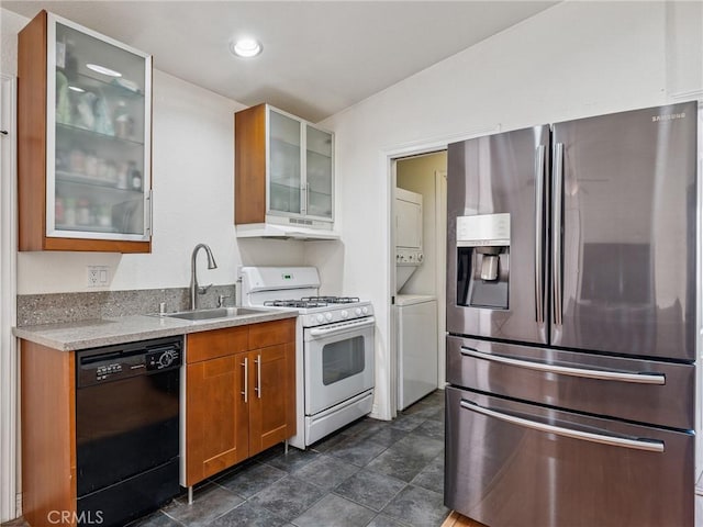 14719 Juniper St, Hesperia, CA 92345 - kitchen featuring stainless steel fridge with ice dispenser, black dishwasher, stacked washer / dryer, white range with gas cooktop, and under cabinet range hood
