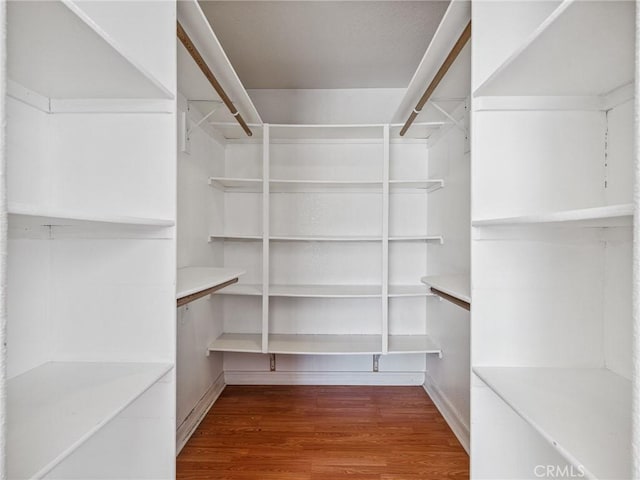 14719 Juniper St, Hesperia, CA 92345 - spacious closet featuring wood finished floors