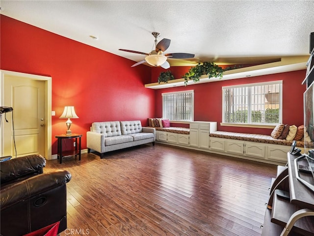 14719 Juniper St, Hesperia, CA 92345 - living area with vaulted ceiling, a ceiling fan, dark wood-type flooring, and a textured ceiling