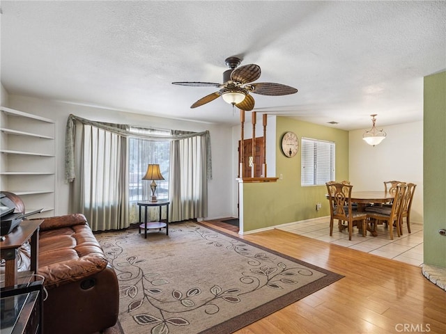 14719 Juniper St, Hesperia, CA 92345 - living area with wood finished floors, a textured ceiling, and ceiling fan
