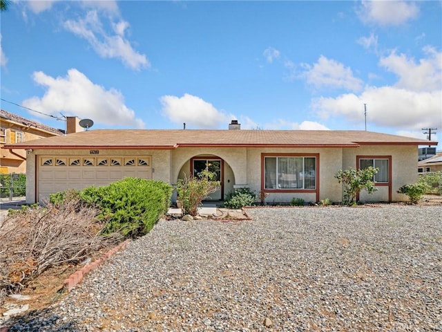 14719 Juniper St, Hesperia, CA 92345 - ranch-style house featuring an attached garage, stucco siding, and a chimney