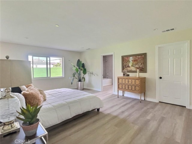 378 W Rosa Parks Rd, Palm Springs, CA 92262 - bedroom with wood finished floors and ensuite bathroom