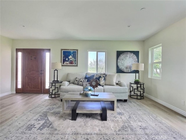378 W Rosa Parks Rd, Palm Springs, CA 92262 - living room featuring baseboards and wood finished floors
