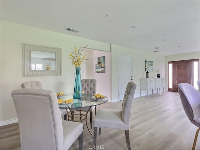 378 W Rosa Parks Rd, Palm Springs, CA 92262 - dining room featuring baseboards and light wood-style flooring