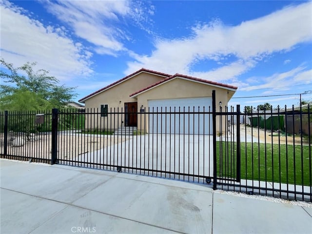 378 W Rosa Parks Rd, Palm Springs, CA 92262 - view of front of property featuring an attached garage, stucco siding, a tiled roof, and a fenced front yard