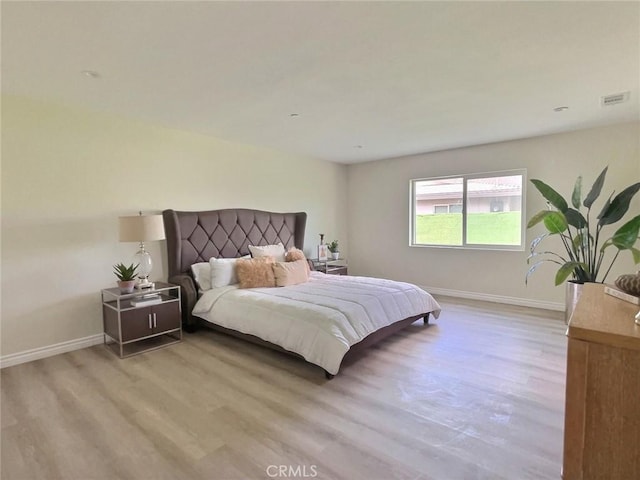 378 W Rosa Parks Rd, Palm Springs, CA 92262 - bedroom featuring light wood-style flooring and baseboards