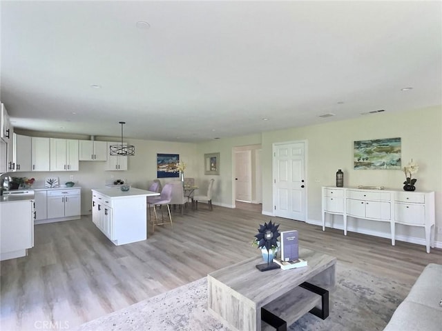 378 W Rosa Parks Rd, Palm Springs, CA 92262 - living area with light wood-type flooring and baseboards