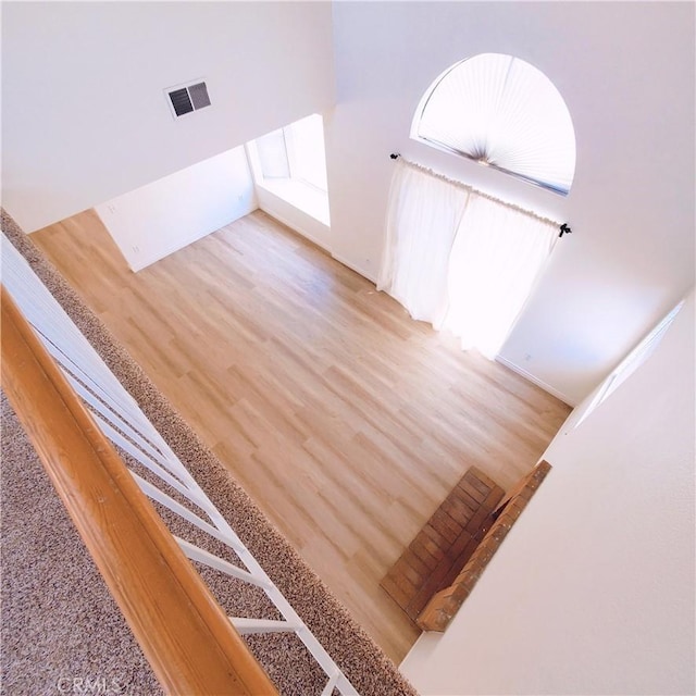 1387 Sycamore Ln, San Bernardino, CA 92408 - stairway with wood finished floors and baseboards