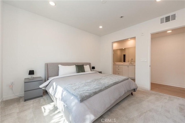 1851 S Union St Unit 10, Anaheim, CA 92805 - bedroom featuring light colored carpet, recessed lighting, and ensuite bath