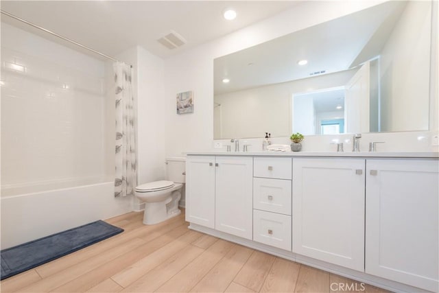 1851 S Union St Unit 10, Anaheim, CA 92805 - bathroom with shower / tub combo, double vanity, wood finished floors, and recessed lighting