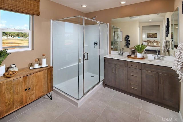 8176 Perada St, Jurupa Valley, CA 92509 - full bathroom featuring double vanity, a stall shower, ensuite bathroom, tile patterned floors, and recessed lighting