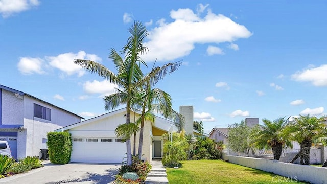 11542 Luzon St, Cypress, CA 90630 - view of front of property with concrete driveway, an attached garage, and a front lawn